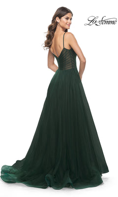 Woman facing away in a floor-length La Femme Sheer-Waist Long A-Line Prom Dress 32130, featuring thin straps, low back, fitted bodice, and flowing tulle skirt for an elegant prom look.