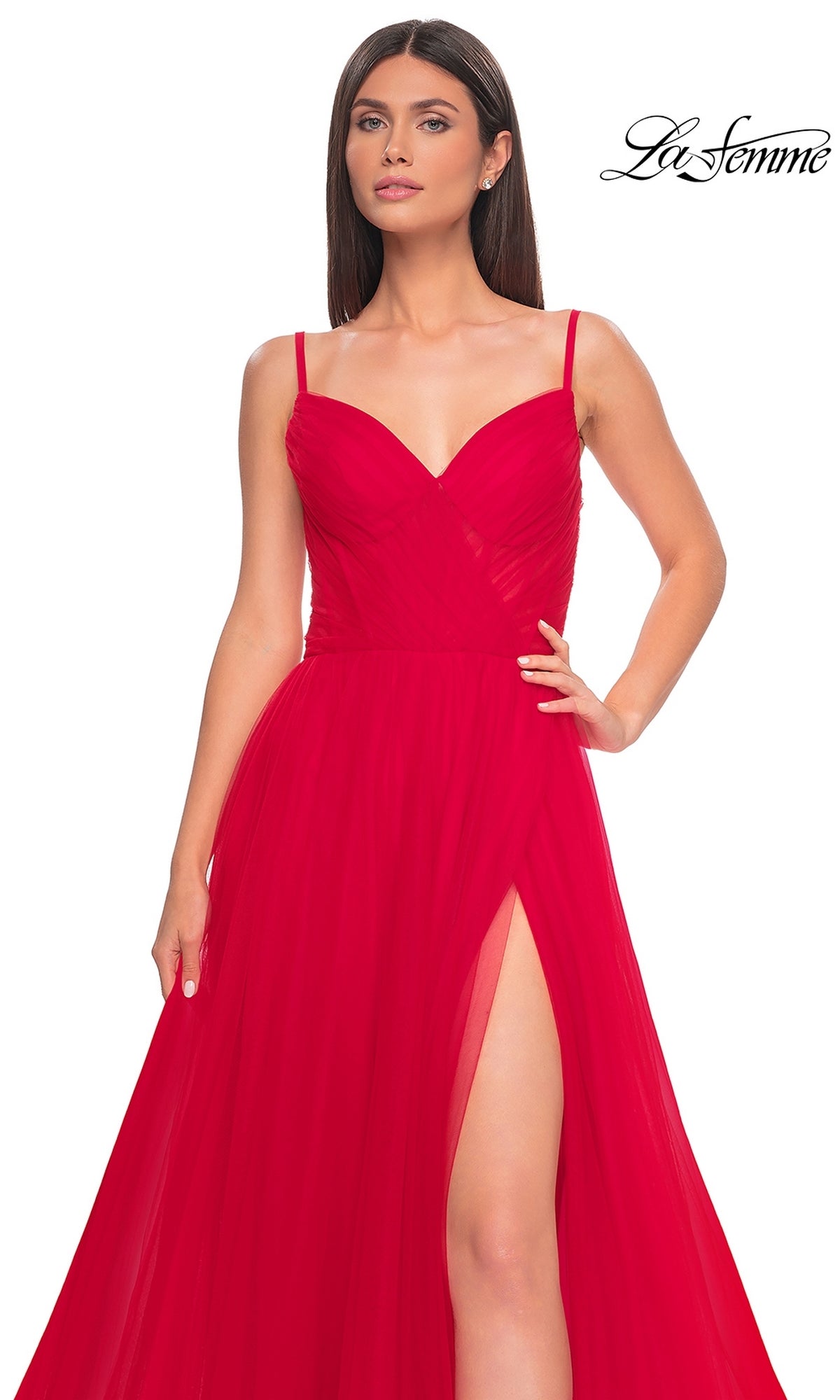 A woman models the La Femme Sheer-Waist Long A-Line Prom Dress 32130 in sleeveless red with thin straps, sweetheart neckline, high slit, and tulle overlay against a plain white background.