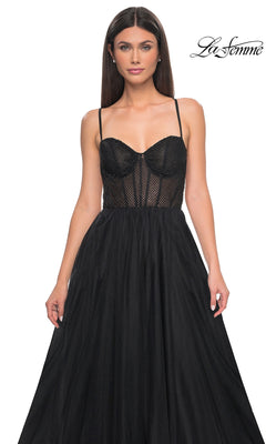 A woman wears the La Femme Embellished Long Tulle Prom Dress 32135, a sleeveless black A-line gown with a mesh and beaded bodice. The "La Femme" logo is displayed in the top right corner.