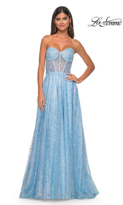 A woman poses with one hand on her hip in the La Femme Strapless Embellished Prom Dress 32136—a light blue, sparkly beaded gown with a fitted bodice and full skirt. The "La Femme" logo appears in the top right corner.