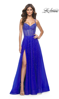 A woman models the La Femme Beaded Long A-Line Prom Dress 32146 in royal blue, featuring a floor-length, sleeveless design with a thigh-high slit and sparkling embellishments, set against a plain white background.