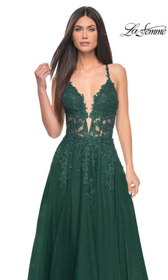 A woman models the La Femme Lace-Embroidered Long Prom Dress 32147 in deep green, featuring floral lace details and a plunging neckline, against a white background. The "La Femme" logo appears in the top right corner.