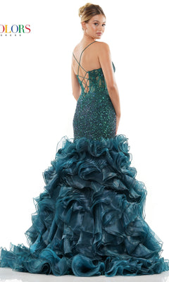 A woman faces away from the camera wearing the Organza Skirt Long Sequin Pageant Dress 3214, featuring teal green sequins, a backless design, and a voluminous ruffled mermaid skirt.