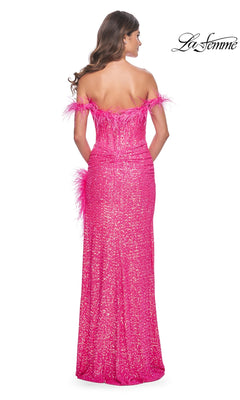A woman is shown from the back wearing the La Femme Feather Long Pink Sequin Prom Dress 32150, which features off-the-shoulder styling and feather accents. The La Femme logo appears in the top right corner.