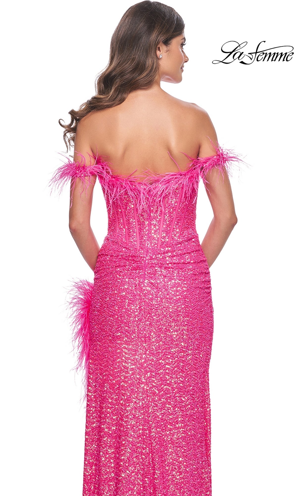 A woman faces away wearing the La Femme Feather Long Pink Sequin Prom Dress 32150, featuring off-the-shoulder sleeves, feathered trim, a fitted silhouette, and sparkling sequins. The 