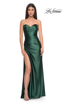 A woman stands against a white background wearing the La Femme Strapless Sweetheart Long Prom Dress 32159 in emerald green satin, featuring a high leg slit and timeless silhouette—ideal for any formal event.