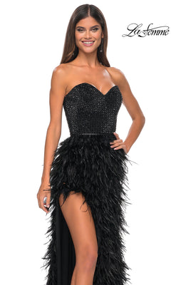 A woman smiles in the La Femme Feather Strapless Long Prom Dress 32165, featuring a sweetheart embellished bodice and feathered skirt, posing against a white background with the "La Femme" logo in the top right corner.