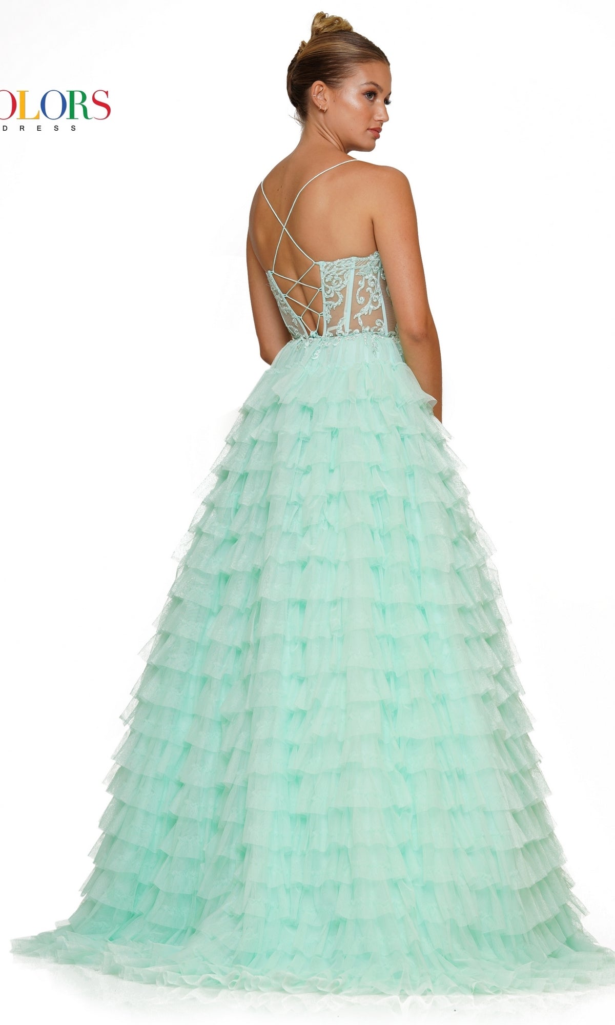 A woman models the Beaded-Corset Long Ruffled Prom Ball Gown 3219, featuring a light blue tiered tulle A-line skirt, lace bodice, lace-up back, and sparkling beaded details, standing against a white background.