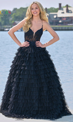 A woman smiles at the camera outdoors near water, wearing the Beaded-Corset Long Ruffled Prom Ball Gown 3219 with a fitted, embellished bodice.