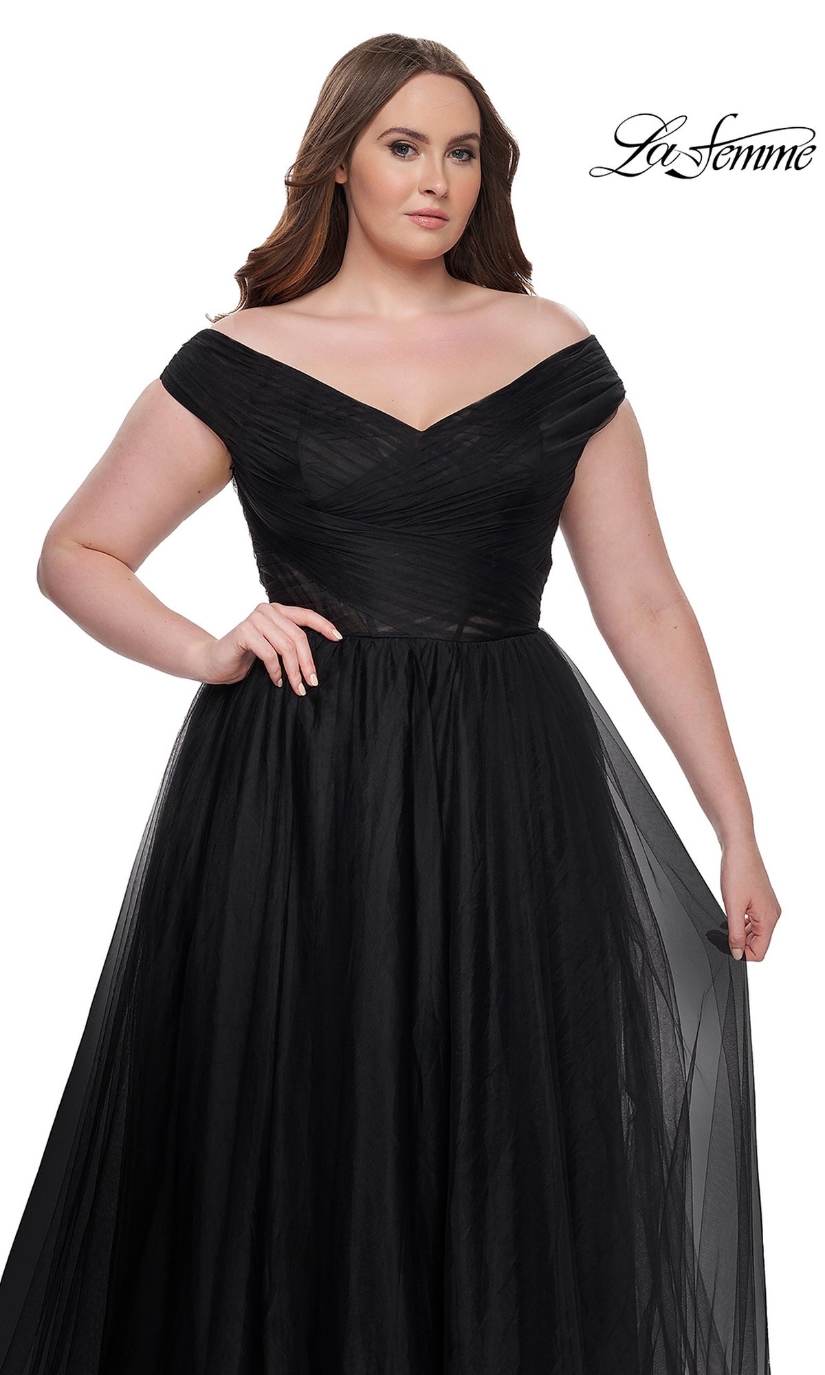 A woman wears the La Femme Plus-Size Long A-Line Prom Dress 32204, an off-the-shoulder formal gown with a tulle skirt, standing against a white background with the La Femme logo in the top right corner.