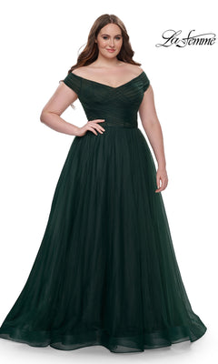 A woman wears the La Femme Plus-Size Long A-Line Prom Dress 32204 in dark green, standing against a white background with the "La Femme" logo in the top right corner.