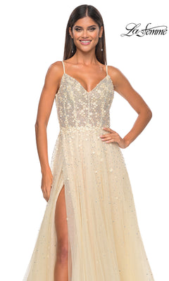 Woman wearing the La Femme Embellished Long A-Line Prom Dress 32215 with spaghetti straps, V-neckline, and high slit, standing against a white background.