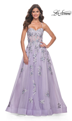 A woman models the La Femme Long Lavender A-Line Prom Dress 32221, featuring floral embroidery, thin straps, and a fitted bodice, against a white background with the La Femme logo in the top right corner.