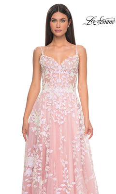 Model wearing the La Femme Sequin-Print Long A-Line Prom Dress 32223, a pink formal gown with white floral embroidery and thin straps, stands against a white background featuring the "La Femme" logo in the top right corner.