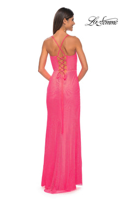 A woman wearing the La Femme Sheer Bustier Long Prom Dress 32227, a floor-length, sleeveless bright pink gown with a lace-up back, stands facing away as the La Femme logo appears in the top right corner.