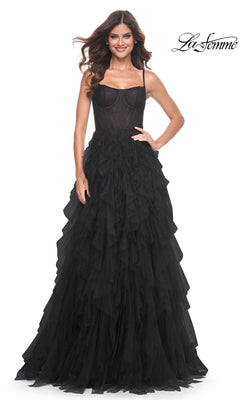 A woman poses against a white backdrop in the La Femme Sheer-Waist Long Ruffled Prom Dress 32233, featuring a black fitted lace bodice with delicate beaded details. The La Femme logo is displayed in the top right corner.