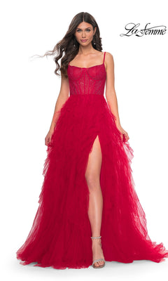 A woman poses in a red La Femme Sheer-Waist Long Ruffled Prom Dress 32233 featuring a sleeveless design, sheer bodice, beaded embellishments, and high slit against a white background. The La Femme logo appears in the top right corner.