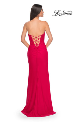 A woman stands facing away in the La Femme Strapless Long Corset Prom Dress 32234, featuring a lace-up back. The "La Femme" logo appears in the upper right corner.