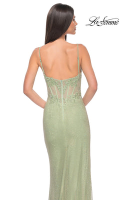 Woman wearing the La Femme Sheer Lace-Bodice Long Prom Dress 32236, a light green gown with thin straps, embroidered lace bodice, sparkling embellished accents, and a semi-sheer mesh back panel.