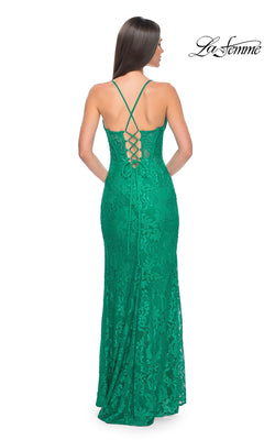 A woman faces away in the La Femme Floral-Lace Long Corset Prom Dress 32248—fitted, green, with a lace-up open back, corset bodice, and thin straps. The "La Femme" brand logo is displayed at the top right.