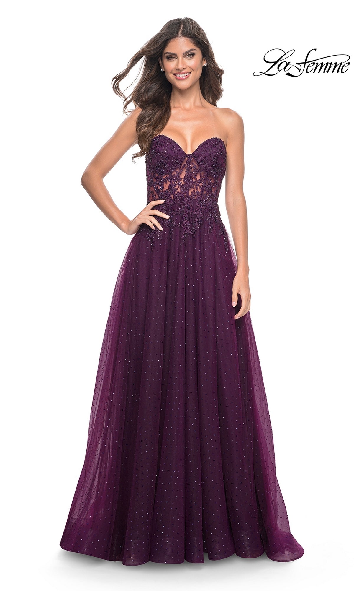 A woman smiles against a white background wearing the La Femme Sheer-Lace Long Beaded Prom Dress 32253; the La Femme logo appears in the top right corner.