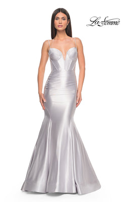 Woman wearing the La Femme Long Corset Mermaid Prom Dress 32269 in fitted silver satin, featuring thin straps and a structured bodice, posing against a plain white background.