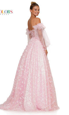 A woman poses and smiles over her shoulder wearing the 3D Butterfly Formal Ball Gown 3226 with sleeves—a light pink, off-the-shoulder dress featuring removable sheer puff sleeves and a textured floral butterfly pattern.