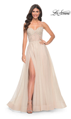 A woman models the La Femme Champagne Long A-Line Prom Dress 32271, featuring a sleeveless sheer bodice, thin straps, and a high slit, set against a white background with the "La Femme" logo in the top right corner.
