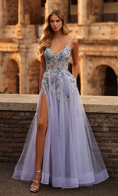 A woman wearing the La Femme Long Lavender A-Line Prom Dress 32288 with floral embroidery and a thigh-high slit poses outdoors before an ancient stone building.