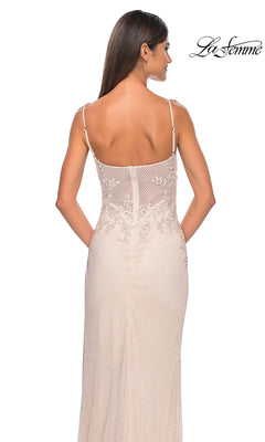 A woman with long brown hair is shown from the back wearing the La Femme Embellished Long Fishnet Prom Dress 32292, a light-colored, sleeveless gown with thin straps and elegant lace beading. The La Femme logo is in the top right corner.