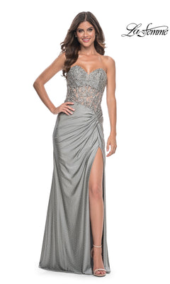 A woman poses in the La Femme Strapless Long Pleated Prom Dress 32301, featuring a strapless bodice, high slit, and pleated detailing, with the "La Femme" logo in the top right corner.