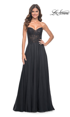 A woman models the La Femme Lace-Bodice Long A-Line Prom Dress 32311, featuring a strapless sheer lace bodice and flowing skirt, against a white background.