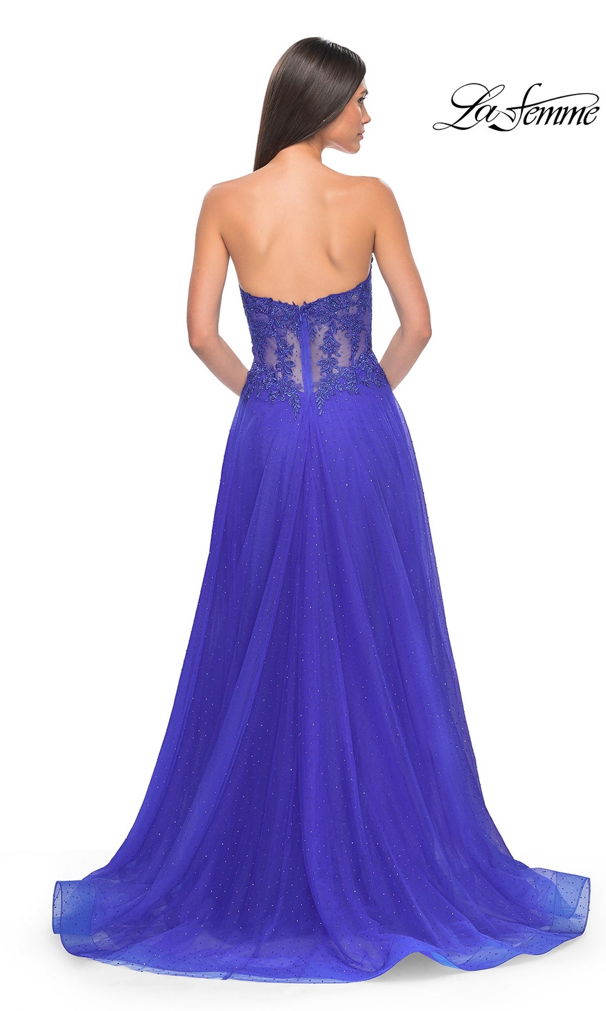 The La Femme Sheer-Waist Long A-Line Prom Dress 32313 is shown in royal blue, featuring a strapless design, sheer beaded lace bodice, and flowing tulle skirt with shimmer overlay, elegantly displayed from the back.