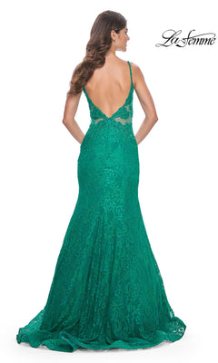 A woman wearing the La Femme Sheer-Sides Long Lace Prom Dress 32315 with thin straps and a low back stands facing away, as the La Femme logo appears in the top right corner.