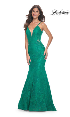 A woman wears the La Femme Sheer-Sides Long Lace Prom Dress 32315 in jade, featuring thin straps, a deep V neckline, and fitted mermaid silhouette. The "La Femme" logo appears in the top right corner.