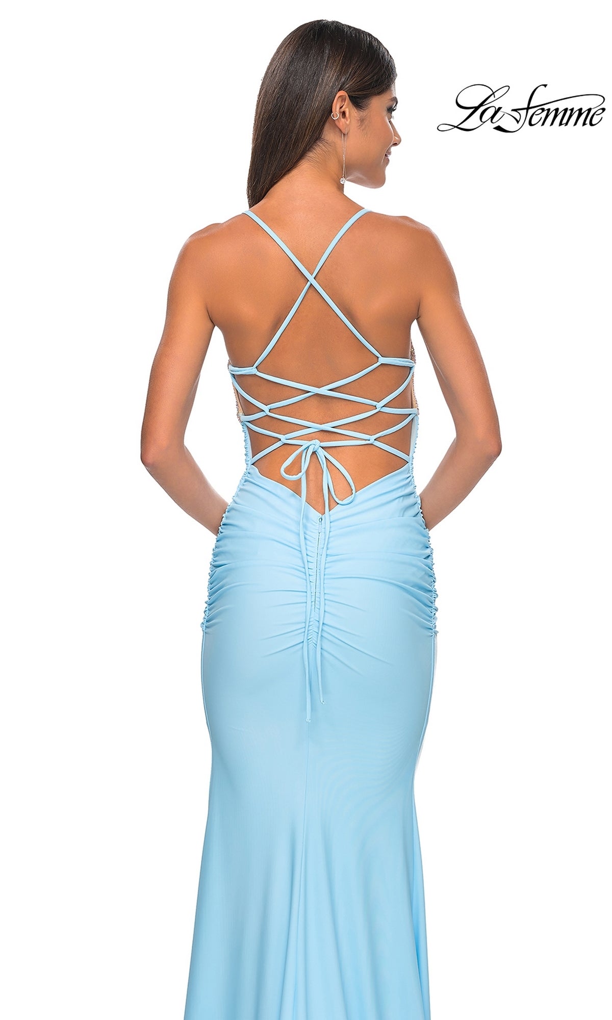 Woman in a light blue La Femme Embellished-Bodice Long Prom Dress 32320, showcasing an embellished bodice, open back with crisscross lace-up straps, and ruched skirt detailing.