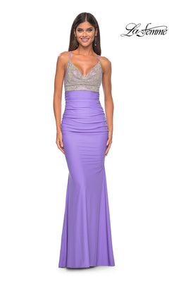 A woman wears the La Femme Embellished-Bodice Long Prom Dress 32320, a sleeveless, fitted lavender gown with a sparkling silver bodice, posing and smiling in front of a plain white background. The "La Femme" logo is in the top right corner.