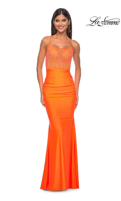A woman wearing the La Femme Backless Bright Long Prom Dress 32325, a sleeveless orange beaded formal gown featuring a fitted bodice and smooth, floor-length flared skirt.