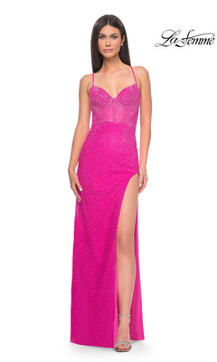 A woman wears the La Femme Cut-Out Long Beaded Prom Dress 32328, featuring bright pink fabric, thin straps, a strappy back, high slit, and sparkling embellishments. The "La Femme" logo appears in the top right corner.