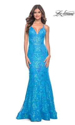 A woman wears the fitted, floor-length La Femme Long Sequin Mermaid Prom Dress 32337 in bright blue with thin straps and embellishments, standing against a white background featuring the La Femme logo.