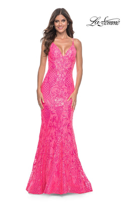 A woman stands and smiles in the La Femme Long Sequin Mermaid Prom Dress 32337, a fitted, sleeveless, bright pink sequin-print gown with a deep V neckline and mermaid silhouette. The "La Femme" logo appears in the top right corner.