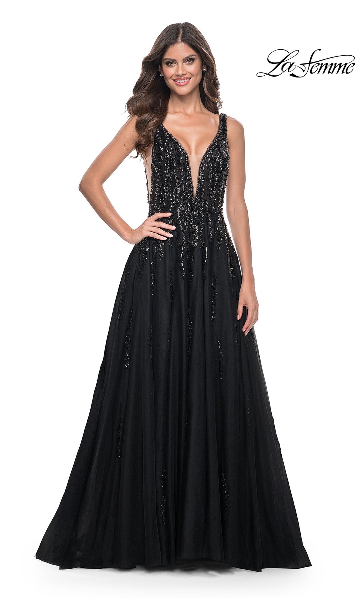 A woman models the La Femme Deep V-Neck Long Black Prom Dress 32345, featuring a sleeveless design, sequin embellishments, and a full skirt, against a white background. The 
