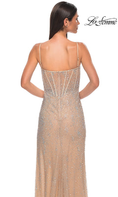 A woman with straight brown hair wears the Beaded Nude Prom Gown (La Femme 32366), a sleeveless, backless formal dress adorned with sparkling sequins. The "La Femme" logo is in the top right corner.