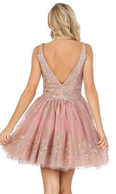 A woman stands with her back to the camera wearing the Silver-Beaded Short Babydoll Hoco Dress 3237, featuring a sleeveless design, deep V-back, beaded bodice, and flared short skirt.