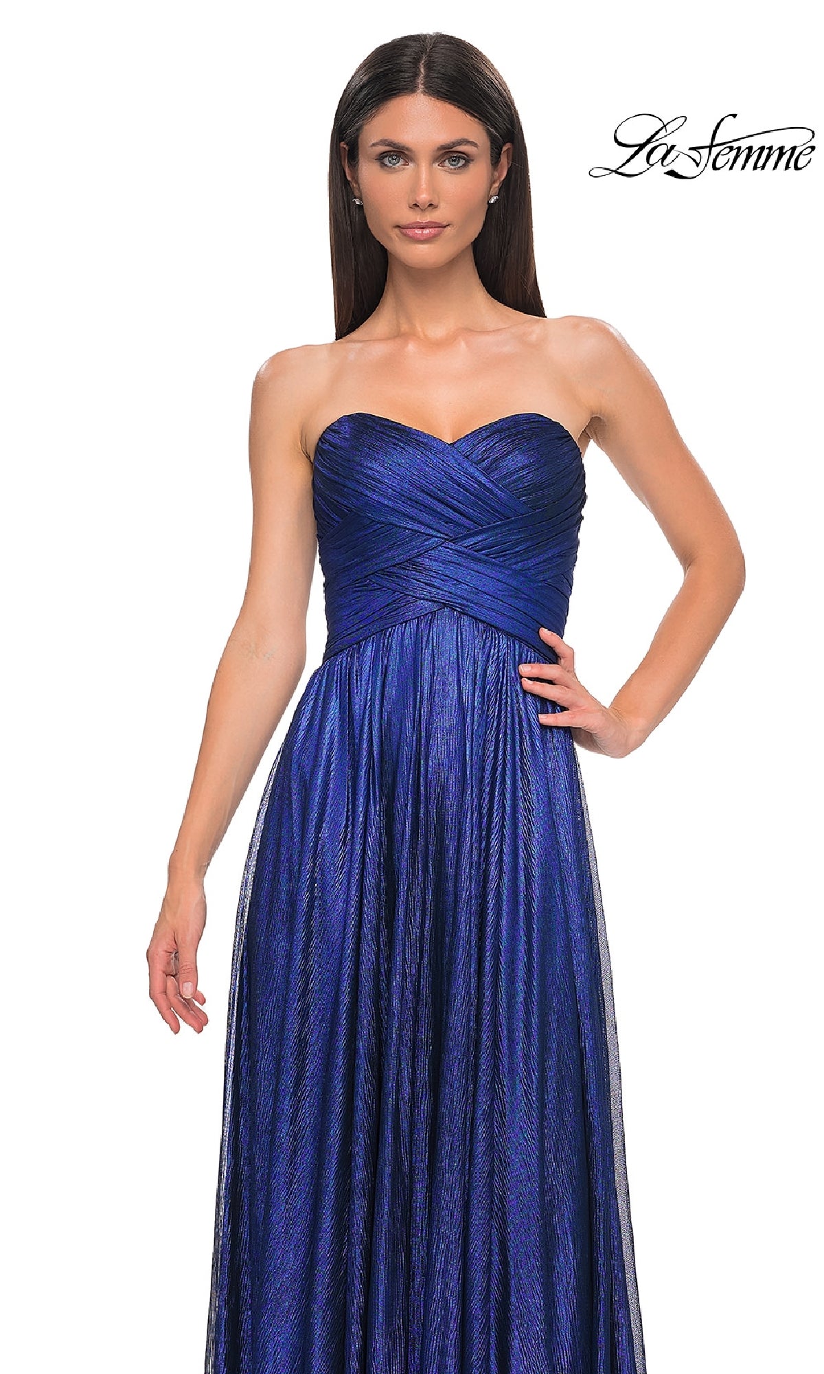 A woman models the Strapless Long Metallic Prom Dress: La Femme 32382, featuring a textured, crisscross bodice and shimmering blue floor-length skirt; the 