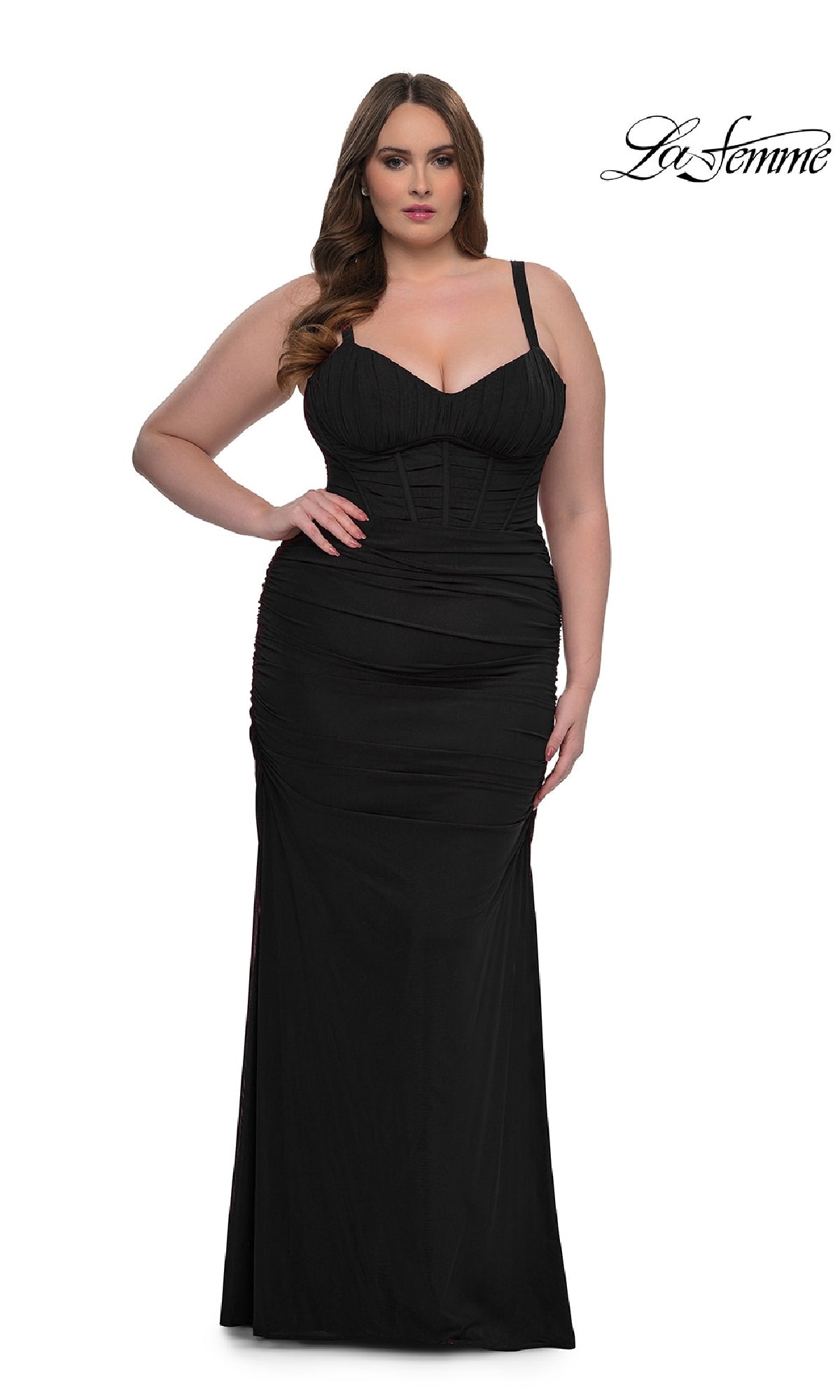 A woman models the Plus-Size Sexy Long Prom Dress: La Femme 32402, a fitted black evening gown with a corset-style bodice, against a plain white background featuring the 