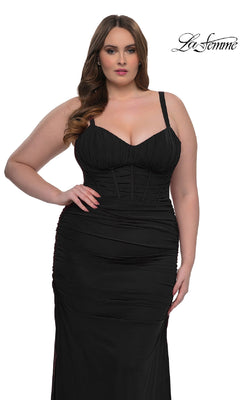 Plus-size model wears the La Femme 32402, a fitted black evening gown with a corset-style bodice and sweetheart neckline, standing against a white backdrop featuring the "La Femme" logo.