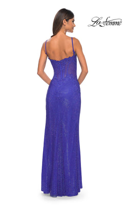 A woman models the Embroidered-Lace Long Prom Dress: La Femme 32409, a fitted, floor-length royal blue gown with thin straps and shimmery fabric. The back view is shown, with the La Femme logo at the top right.