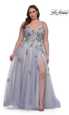 A woman models the Long Plus-Size Prom Ball Gown: La Femme 32412, a lavender, floor-length dress with lace embroidery, sheer tulle skirt, thigh-high slit, and spaghetti straps against a white background.