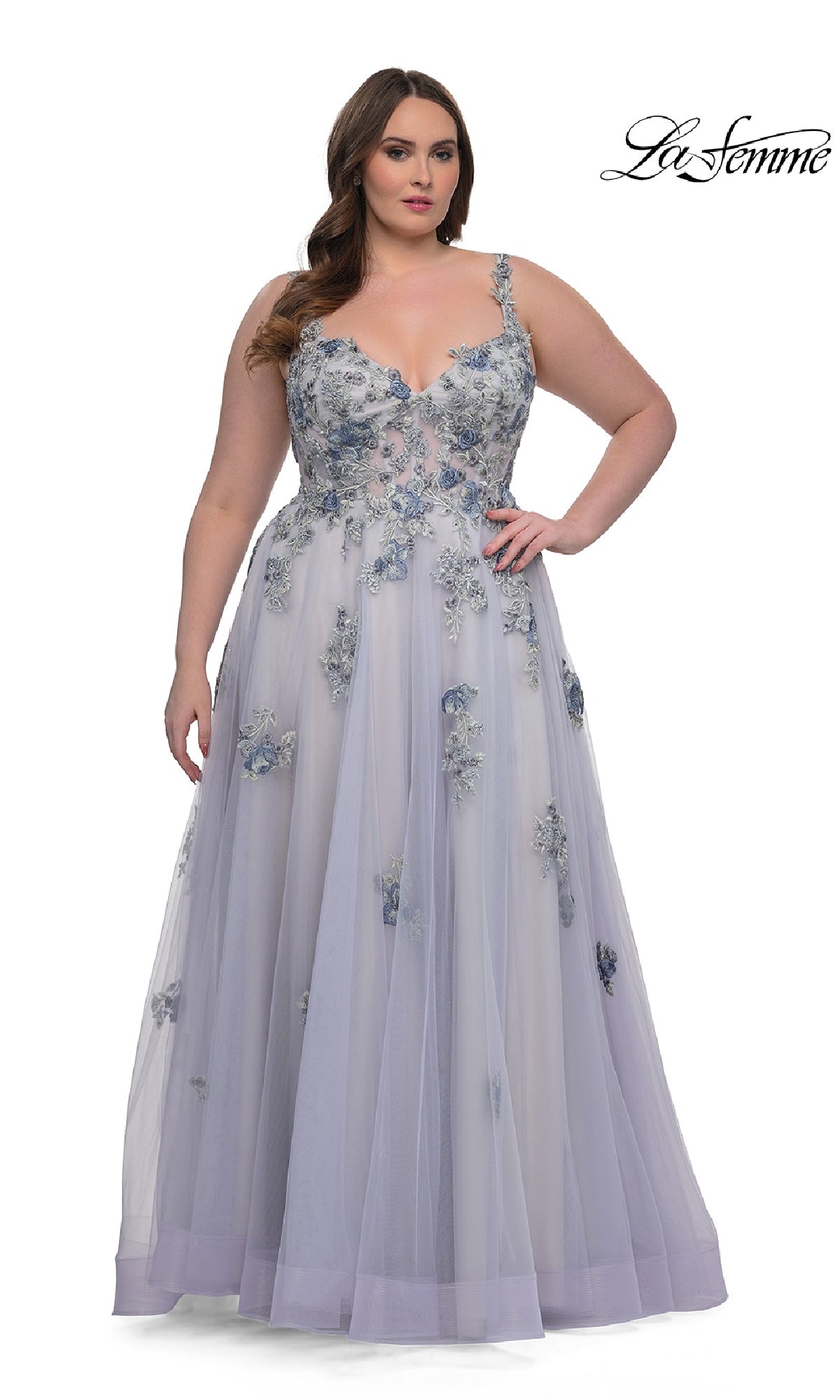 A woman faces forward in the La Femme 32412, a sleeveless, floor-length lavender plus-size prom ball gown with lace embroidery and corset bodice. The 